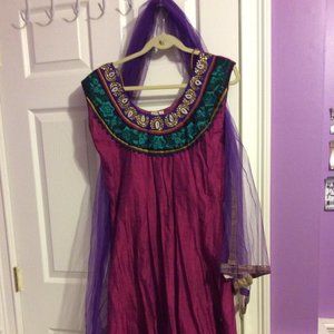 Purple kurta with multicolored embroidery.